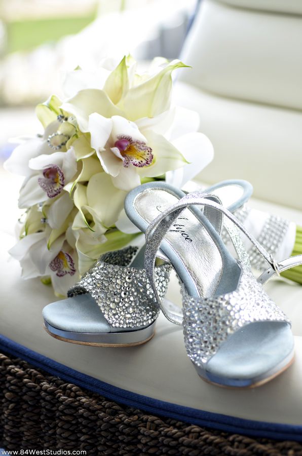 White calla lily and orchid wedding florals with silver and crystal bridal high heels. South Florida weddings by www.84WestStudios.com (954)236-9000.