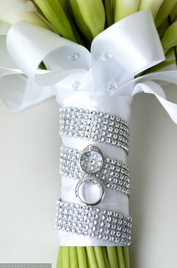 White satin and swarovski crystal band bridal bouquet with white gold diamond engagement ring. South Florida weddings by www.84WestStudios.com (954)236-9000.